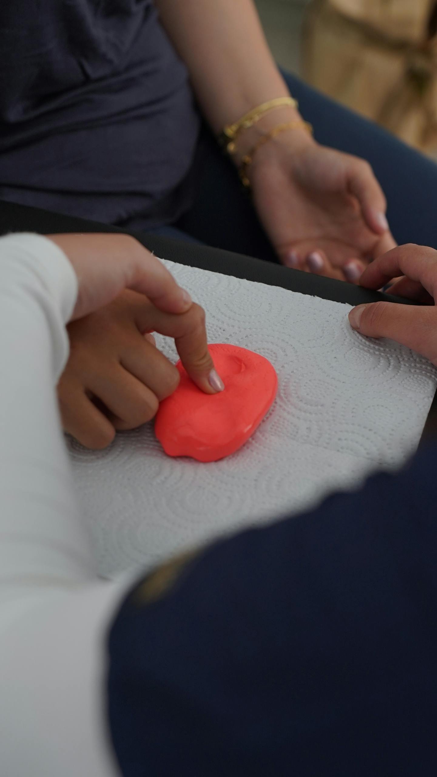Children engaging in sensory play with clay, focusing on tactile stimulation. Fine Motor Skills